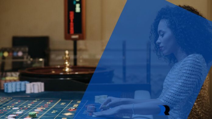 A Woman Betting on a Roulette Table